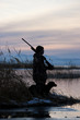 man and his dog duck hunting