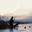 man out hunting with his dog