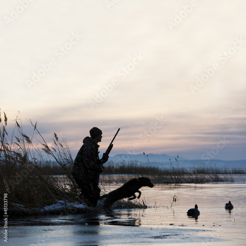 Photo: man out hunting with his dog man out hunting with his dog