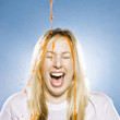 girl getting goo poured on her head