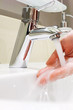 Photo: Washing arm in sink bathroom. Washing arm in sink bathroom.
