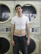 man wearing a shrunken t-shirt