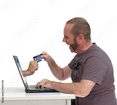Photo: Homme effectuant un paiement en ligne Homme effectuant un paiement en ligne