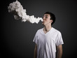 Foto: man blowing smoke man blowing smoke