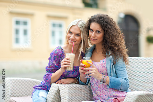 Photo: woman friends at cafe woman friends at cafe