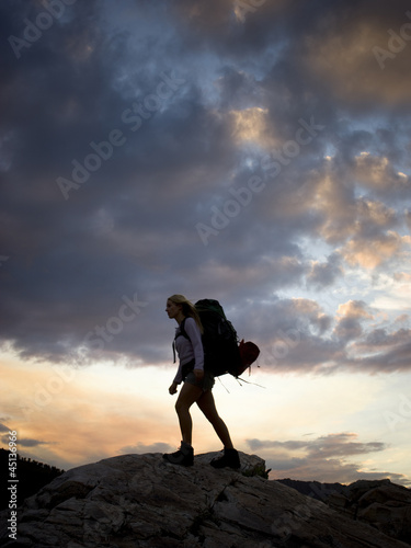 Photo: backpacker hiking through the wilderness backpacker hiking through the wilderness