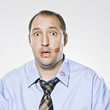 businessman with lipstick kiss marks all over his face