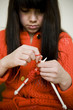 young woman knitting