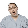 Portrait of yawning man in surgical scrubs,studio shot