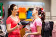 Shop Assistant Helping Custome...