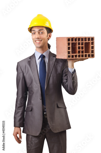 Photo: Businessman with bricks on white Businessman with bricks on white