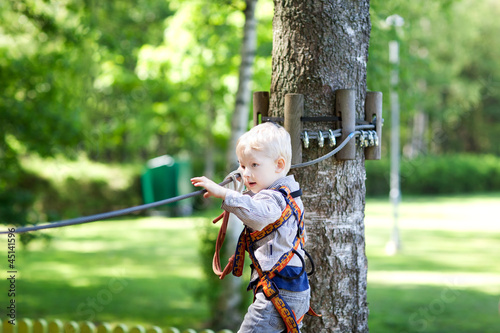 Photo: little boy at a canopy tour little boy at a canopy tour
