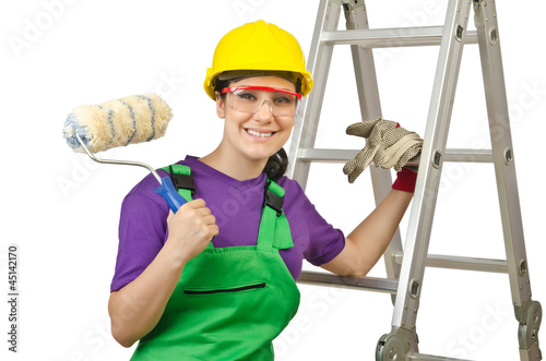 Photo: Woman worker with ladder on white Woman worker with ladder on white
