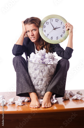 Photo: Woman with lots of discarded paper Woman with lots of discarded paper