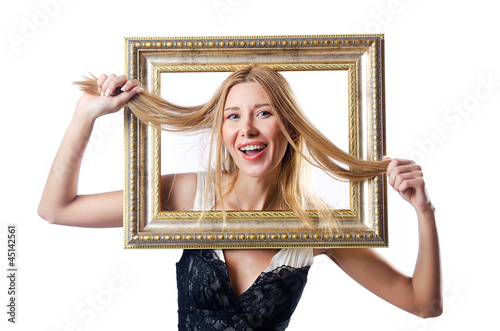 Photo: Woman with picture frames on white Woman with picture frames on white