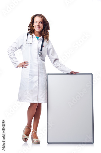 Photo: Woman doctor with blank board Woman doctor with blank board