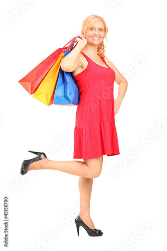 Photo: Mature woman holding shopping bags Mature woman holding shopping bags
