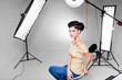 young model posing in professionally equipped studio