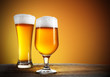 Photo: Beer glasses with gold background Beer glasses with gold background