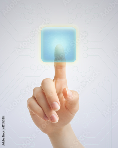 Photo: Hand pushing blue button Hand pushing blue button