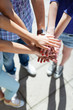 Photo: Friends with hands stacked in unison Friends with hands stacked in unison