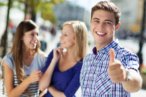 Photo: Young man showing thumbs up Young man showing thumbs up