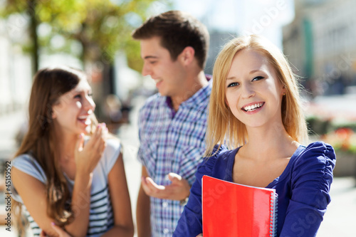 Photo: Female student with friends Female student with friends
