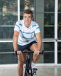 Man Exercising On Spinning Bike