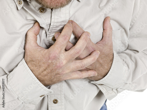 Photo: old man holding his chest old man holding his chest
