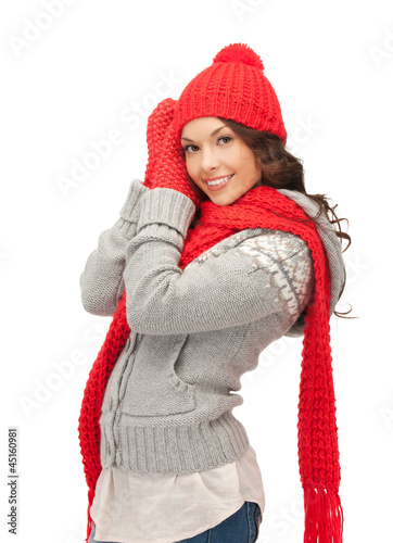 Photo: beautiful woman in hat, muffler and mittens beautiful woman in hat, muffler and mittens