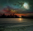 The ocean, sunset and moon