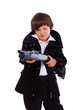 Portrait of handsome kid posing in studio with gun
