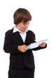 Portrait of handsome kid posing in studio with ipad