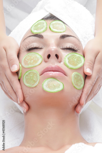 Photo: portrait of young beautiful woman being treated portrait of young beautiful woman being treated