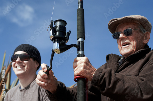 Photo: Grandfather and Grandchild fishing together Grandfather and Grandchild fishing together