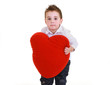 Foto: Funny child with red heart isolated on white background Funny child with red heart isolated on white background