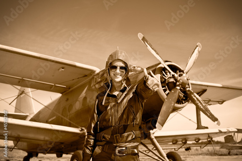 Photo: Portrait of beautiful female pilot Portrait of beautiful female pilot