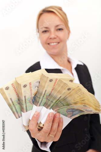 Photo: Woman handing you a stack of romanian currency Woman handing you a stack of romanian currency