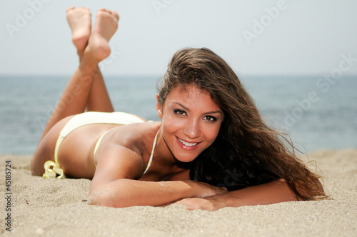 Photo: Woman with beautiful body on a tropical beach Woman with beautiful body on a tropical beach