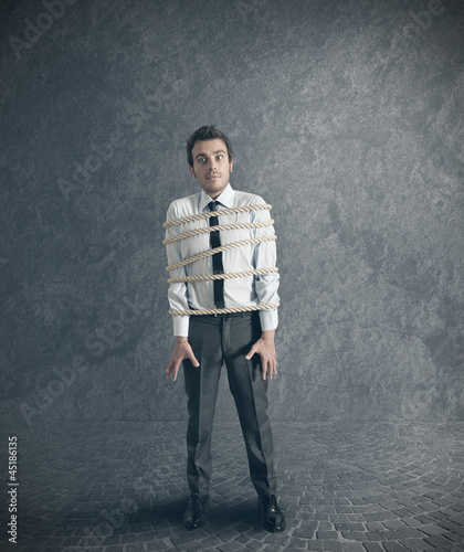 Photo: Businessman tied with rope Businessman tied with rope