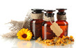 medicine bottles and calendula, isolated on white