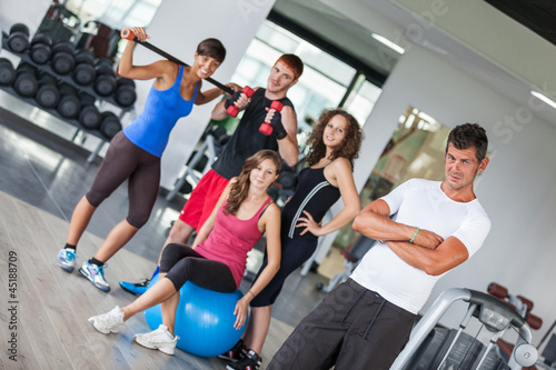 Photo: Group of People at Gym with Instructor Group of People at Gym with Instructor