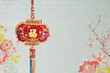 Chinese Hanging Decoration on Lotus Flower Background.