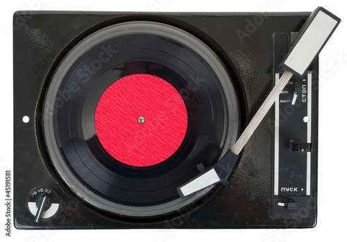 Photo: Old turntable with vinyl record Old turntable with vinyl record