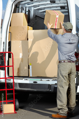 Photo: Delivery postal service man. Delivery postal service man.
