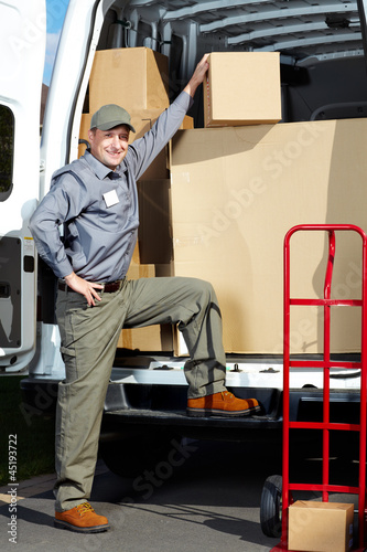 Photo: Delivery postal service man. Delivery postal service man.