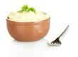 Mashed potato with parsley in the bowl isolated on white