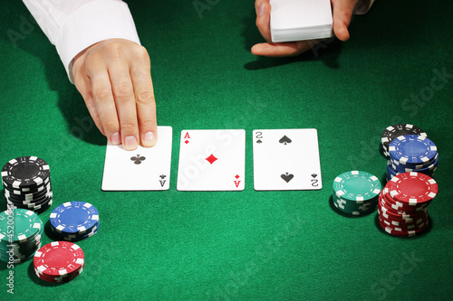 Photo: Poker setting on green table Poker setting on green table