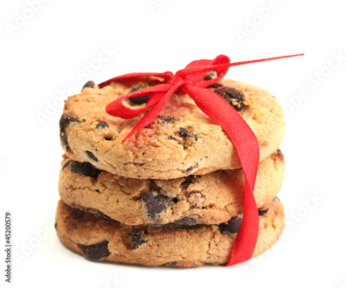 Photo: Chocolate chips cookies with red ribbon isolated on white. Chocolate chips cookies with red ribbon isolated on white.