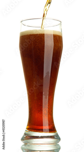 Photo: kvass poured into a glass, isolated on white kvass poured into a glass, isolated on white